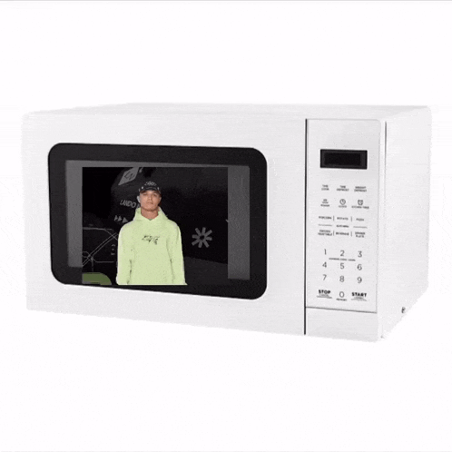 a white microwave with a picture of a man in a green hoodie on the screen