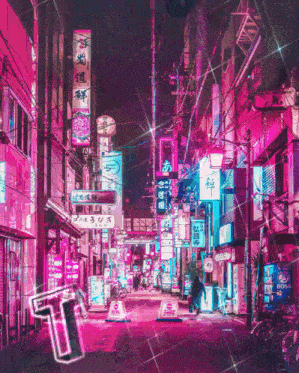 a neon sign that says ' t ' on it is in the middle of a city street
