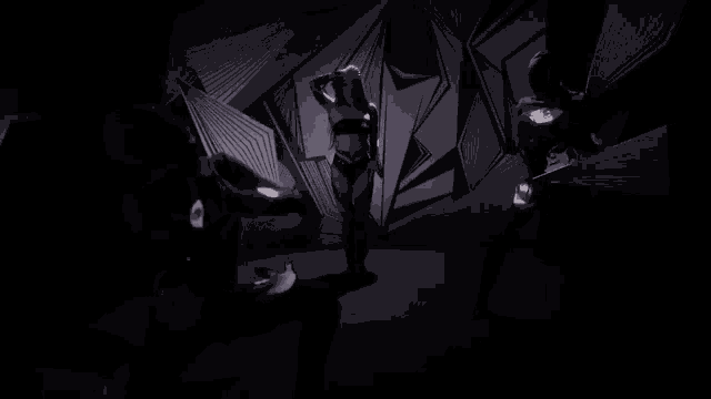 a woman is dancing in a dark room while a man stands behind her
