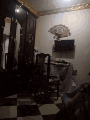 a room with a clock on the wall and a tv