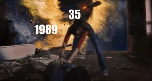 a man is standing in front of an explosion with the year 1989 written on the bottom