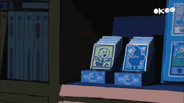 a cartoon of a shelf with cards on it and the word ok on the top