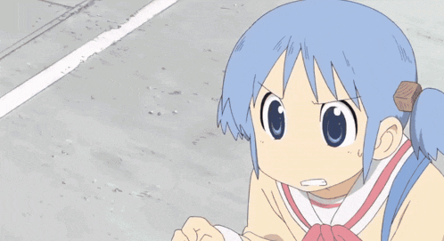 a girl with a surprised look on her face has her eyes closed