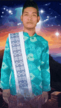 a man in a blue shirt and plaid shorts stands in front of a night sky