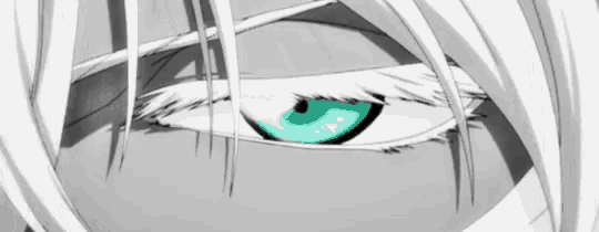 a close up of a person 's eye with white hair and a green eye .