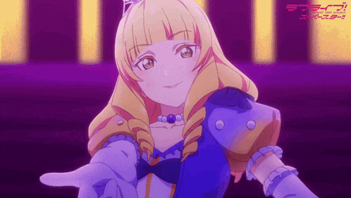 a girl in a blue dress is pointing her finger at the camera