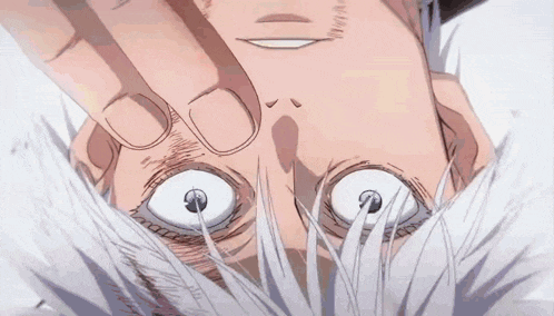a close up of a person 's face with white eyes and a hand covering his face .