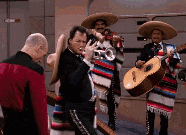 a man playing a trumpet and a man playing guitar