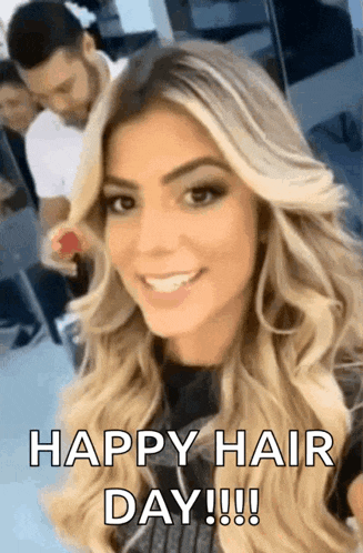 a woman with long blonde hair is smiling and looking at the camera with the words `` happy hair day ! ''