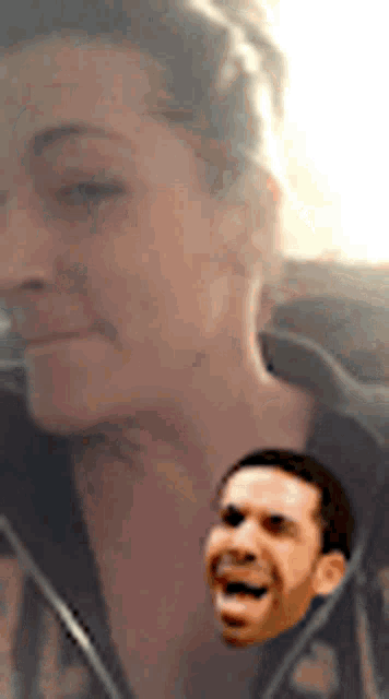 a close up of a woman 's face with a picture of a man 's face behind her