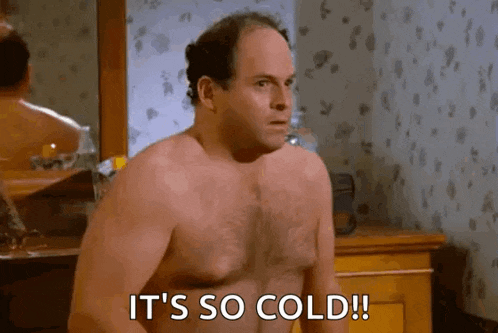 a shirtless man is standing in front of a mirror and says `` it 's so cold ! ''