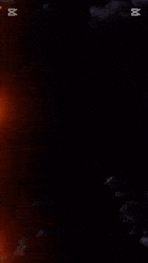 a circle of fire is surrounded by sparks and the letter m is visible