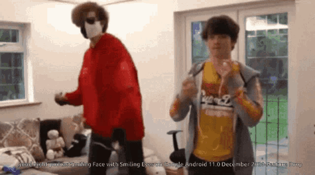 a man in a red shirt is dancing with another man in a yellow shirt in a room