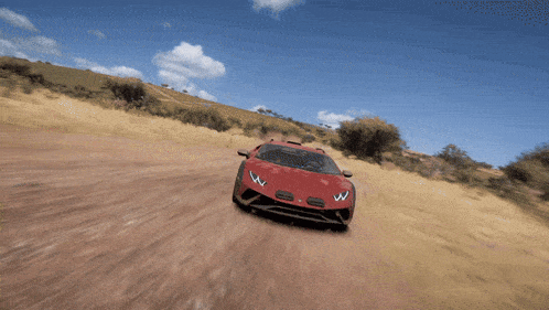 a red sports car driving down a dirt road
