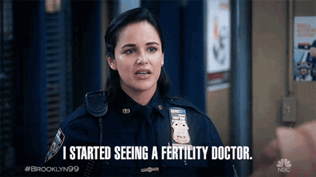 a woman in a police uniform is talking about seeing a fertility doctor
