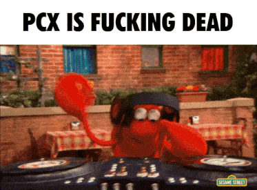 a sesame street character is playing music on a dj mixer