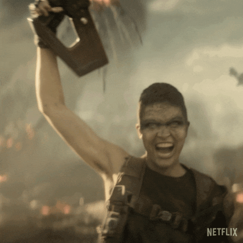 a man is holding up a trophy with netflix written on the bottom