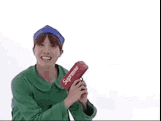 a man in a green jacket is holding a supreme gun while money is falling around him