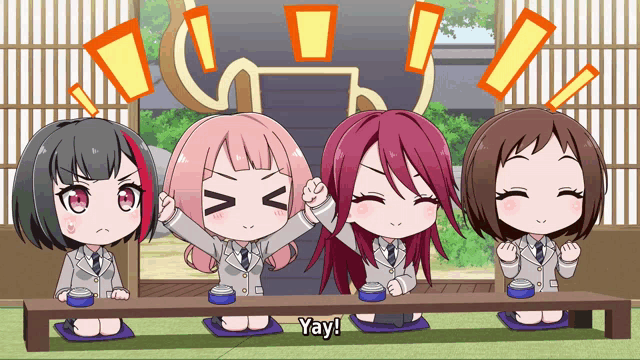 a group of anime girls are sitting at a table and one of them is saying yay