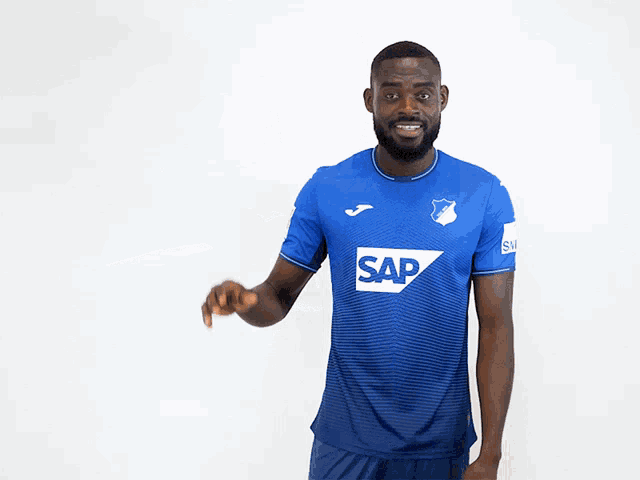a man wearing a blue shirt with the word sap on the front