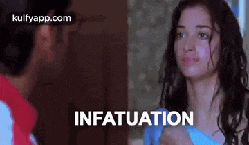 a man and a woman are looking at each other with the word infatuation written in the corner .