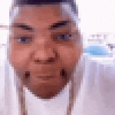 a pixelated image of a person 's face with a blue background