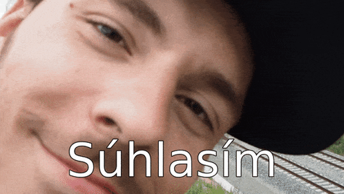 a close up of a man 's face with the word suhlasim on the bottom right