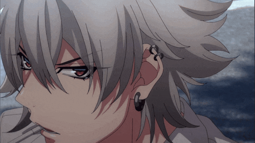 a close up of a person 's face with gray hair