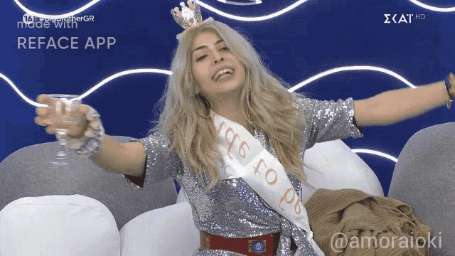 a woman wearing a sash that says ' bride to be ' is sitting on a couch