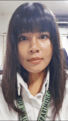a woman wears a lanyard that says department of health