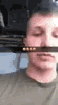 a close up of a man 's face with a blurred background .