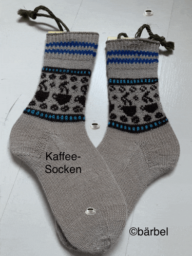 a pair of knitted socks with the word kaffee-socken on them