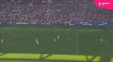 a soccer game is being broadcasted by magenta