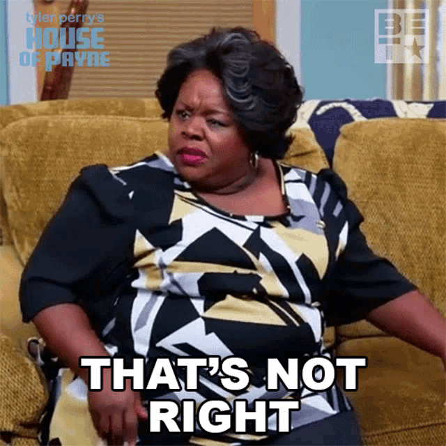 a woman sitting on a couch with the words that 's not right