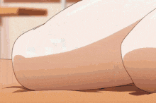 a close up of a person 's feet on a wooden floor .