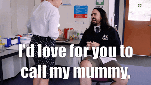 a man sitting in a chair with the words " i 'd love for you to call my mummy "
