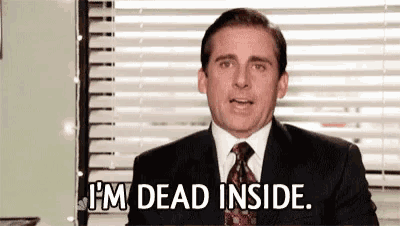 a man in a suit and tie is sitting in front of a window and says `` i 'm dead inside . ''