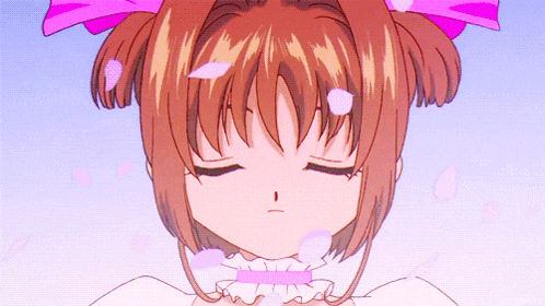 a girl with a pink bow on her head is sleeping