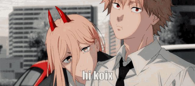 a man and a girl are standing next to each other and the girl has red horns on her head