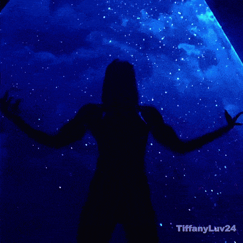 a woman in a red bikini is dancing in a dark room with tiffanyluv24 written on the bottom right