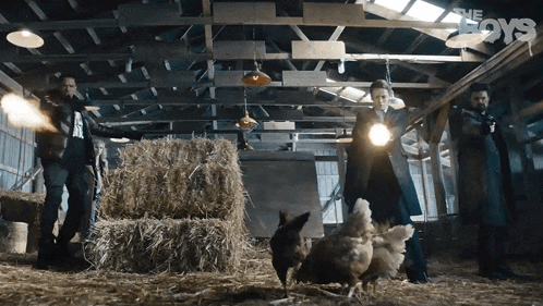 a group of people standing in a barn with the word boys on the bottom