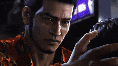 a man holds a woman 's head in a video game