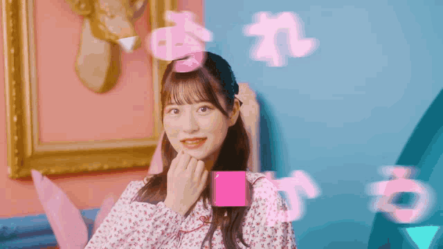 a girl in a pink and white floral dress is surrounded by pink letters and numbers
