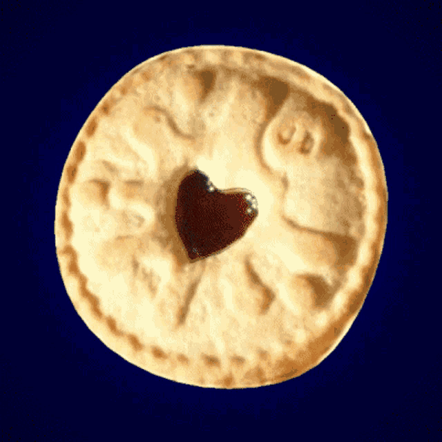 a cookie with a heart shaped jam in the center