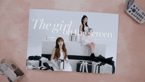 a magazine opened to a page that says the girl on the screen