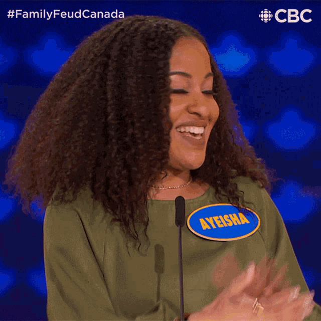 a woman wearing a name tag that says ayeisha
