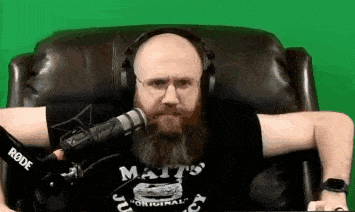 a man with a beard is wearing headphones and a shirt that says matt 's juicy .