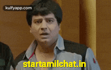 a man with a surprised look on his face and the words starttamilchat.in on the bottom