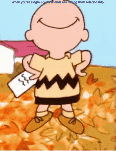 a cartoon of charlie brown smiling and holding a piece of paper