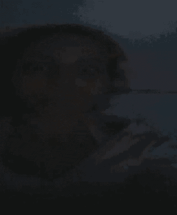 a black background with a shadow of a person